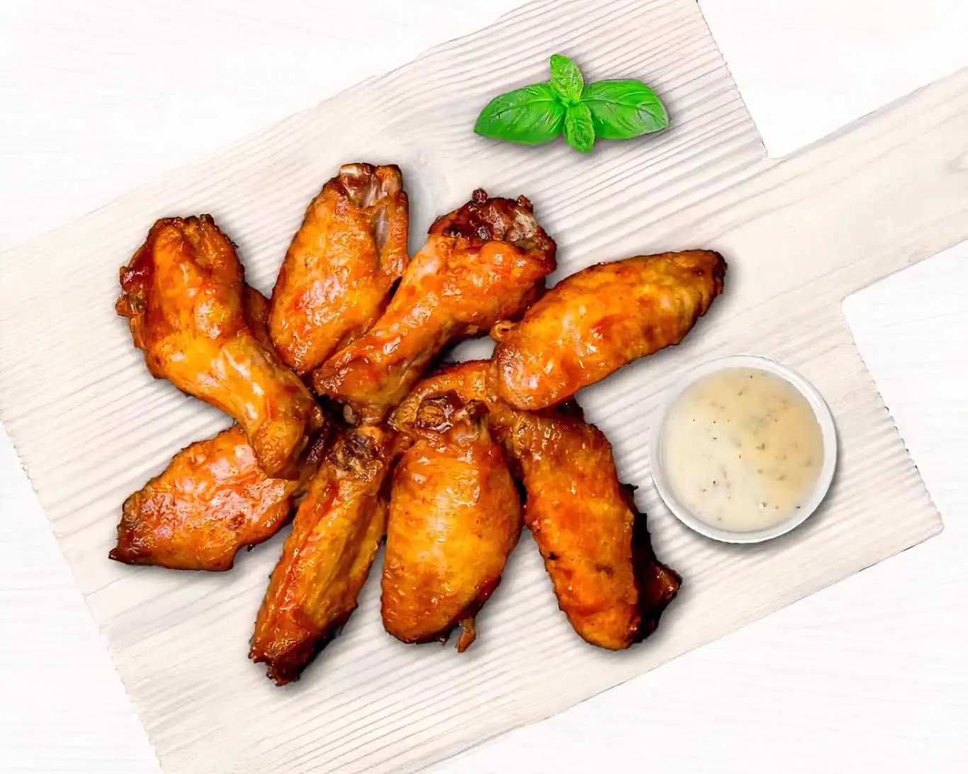 Oven-baked chicken wings at Freshslice Pizza Saskatoon - baked to golden brown, tossed in your choice of Hot, BBQ or Plain sauce
